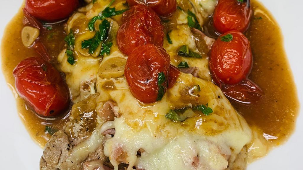 Veal Saltimbocca · Fontina cheese, prosciutto di parma, plum tomatoes, sage, Trebbiano wine, and whipped potatoes.