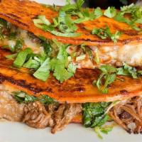 Birria Quesadilla  · Two quesadillas: stewed beef, a blend of cheeses, red onion and cilantro. Crisped to perfect...
