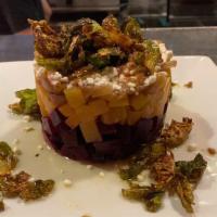 Stacked Beets · stacked roasted red & yellow beets, goat cheese, caramelized onions, herb oil, fried brussel...