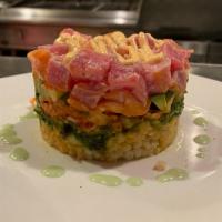 Spicy Salmon & Tuna Tower · raw ahi tuna & salmon, couscous, seaweed salad, diced 
cucumber, avocado, kimchi, sriracha a...