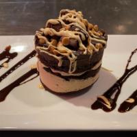 Peanut Butter Brownie Tower · alternating layers of chocolate brownie and peanut butter mouse topped with reeses peanut bu...