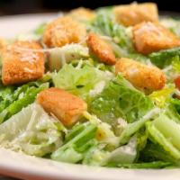 Caesar Salad. · Crisp romaine lettuce, croutons, parmesan cheese, hard boiled egg, anchovies & Caesar dressing