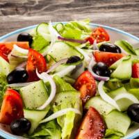 Greek Salad · Garden salad topped with feta cheese, anchovies & kalamata olives