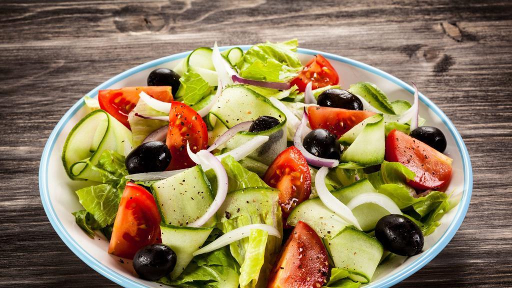 Greek Salad · Garden salad topped with feta cheese, anchovies & kalamata olives