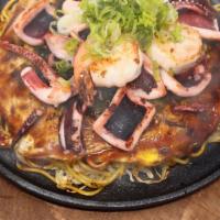 Seafood Okonomiyaki · Topped with Seafood - Layered Pancake meal of pork, vegetables, noodles, and eggs