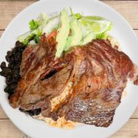 Carne Asada Special · Grilled steak with rice, beans, salad, and tortillas.