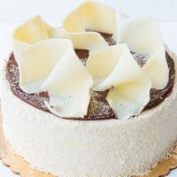 White Cloud · White chiffon cake layered with white chocolate mousse icing, surrounded by vanilla buttercr...