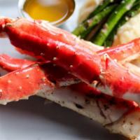Alaskan King Crab Dinner · One pound of king crab poached in citrus and creole seasonings, served with garlic butter, m...
