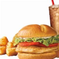 Classic Grilled Chicken Sandwich Combo · 100% all white meat grilled chicken breast topped with fresh lettuce, ripe tomatoes and mayo...