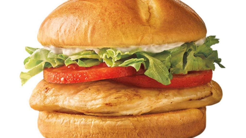 Classic Grilled Chicken Sandwich · 100% all white meat grilled chicken breast topped with fresh lettuce, ripe tomatoes and your choice of mustard, mayo or ketchup, served on a warm Brioche bun.
