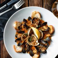 Clams & Mussels Mix · Marinara sauce, topped with homemade garlic bread .