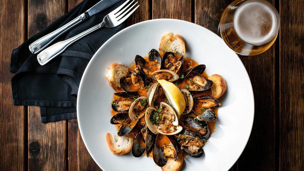 Clams & Mussels Mix · Marinara sauce, topped with homemade garlic bread .