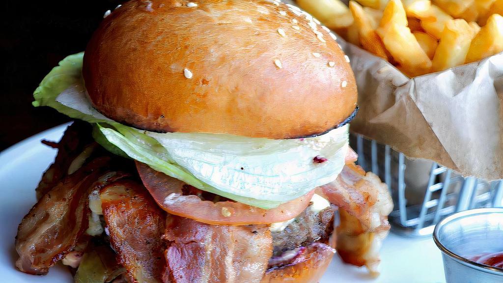 Classic Bacon Cheeseburger · Homemade angus burger, lettuce, onion, tomato, pickles, Bacon, and American cheese.