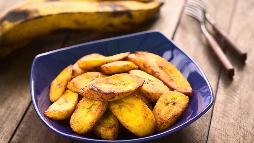 Fried Plantains · Ripe sliced plantains fried to perfection, served with Haitian pickled relish (pikliz).