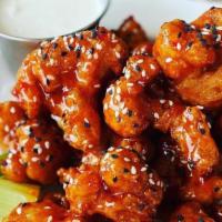 Korean Crispy Cauliflower With Bleu Cheese · Lightly fried cauliflower tossed in a sweet and spicy chili sauce. garnished with sesame see...
