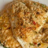 Kellys Haddock Risotto · Pan- Seared Haddock topped with crab meat served over homemade vegetables Risotto.