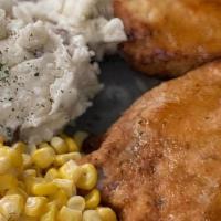Maple Pork Chops · Maple and mustard encrusted pork chops served with two sides.
