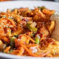 Spicy Cashew Chicken · Sauteed chicken tenderloins, shallots, green beans, cashews, and shredded carrots served ove...
