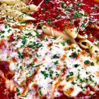 Eggplant Parmigiana · Lightly breaded, crispy eggplant slices topped with marinara sauce and mozzarella cheese, an...