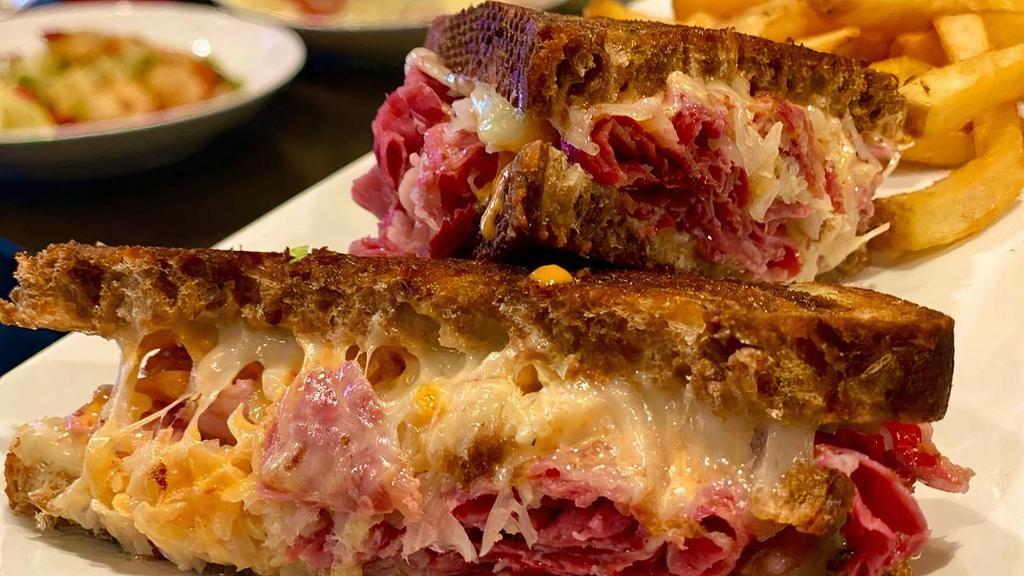 Grilled Reuben · Corned beef, sauerkraut, Swiss cheese, and Russian dressing served on marble rye.