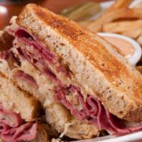Shelly'S Reuben · Your choice of turkey or corned beef on toasted deli rye bread with sauerkraut, melted swiss...