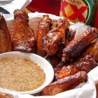 Campfire Wings · One pound of roasted (not fried), well-seasoned and marinated jumbo chicken wings with choic...