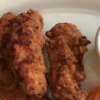 Chicken Tenders · Chicken tenders, coated with bread crumbs, deep fried and served with shelly's honey mustard...