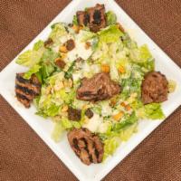 Caesar Salad · Crispy Romaine lettuce, homemade croutons, parmesan cheese tossed in a Caesar dressing