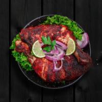Tantalizing Tandoor Chicken · Chicken pieces marinated in yogurt and powdered spices, grilled in a clay pot tandoor till t...