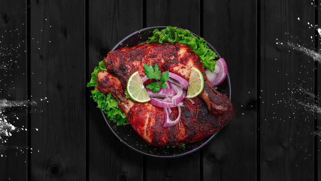 Tantalizing Tandoor Chicken · Chicken pieces marinated in yogurt and powdered spices, grilled in a clay pot tandoor till the outside is beautifully charred and the meat is juicy and succulent.
