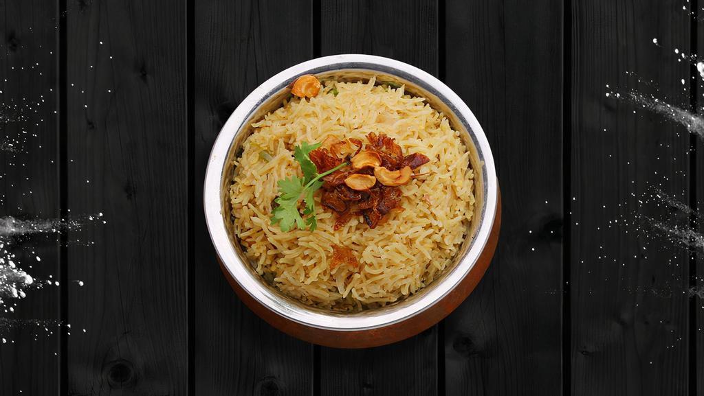Vegetarian'S Biryani · Long grained rice flavored with fragrant spices flavored along with saffron and layered with vegetables and cooked with biryani masala gravy.