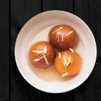 Juicy Gulab Jamun · Deep-fried dumplings soaked in a sweet, sticky sugar syrup with the delicate rose flavor.