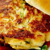 Crab Cake Sandwich · A 5 oz crab cake served on a toasted bun with lettuce, tomato and a side of crab sauce. Serv...