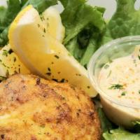 Crab Cake (1) · A 5 oz crab cake served with lemons and house made crab sauce.