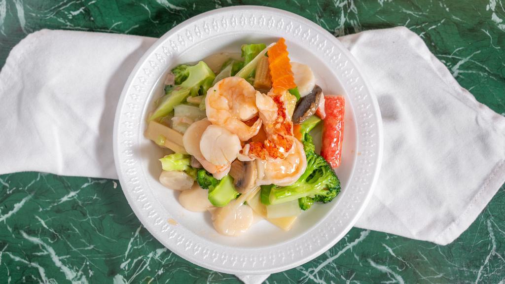 Seafood Delight · Large shrimp, scallop, lobster tail and crab meat with veggies in a house special white sauce.