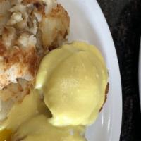 Classic Benedict · Two poached eggs, Canadian bacon, English muffin and hollandaise sauce.