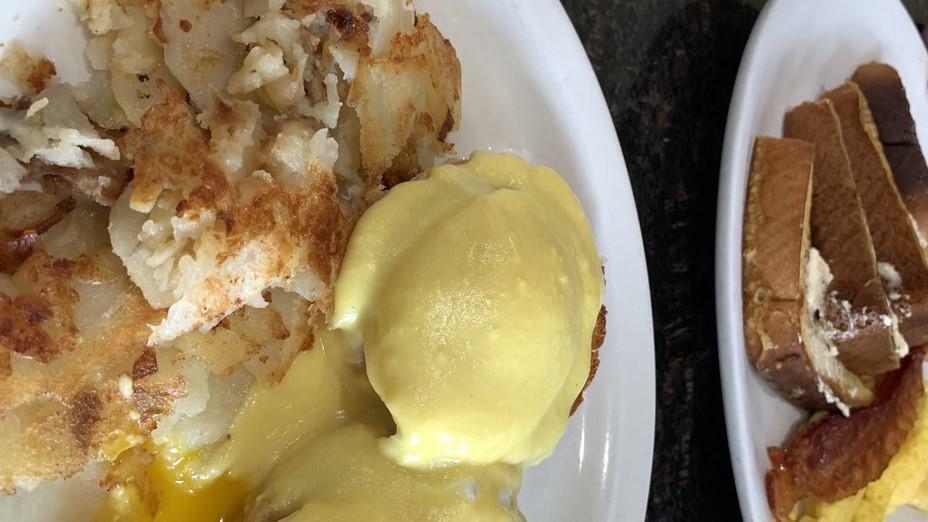 Classic Benedict · Two poached eggs, Canadian bacon, English muffin and hollandaise sauce.