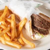 Gyro Platter · Served with small Greek salad, french fries, pita bread and tzatziki sauce.