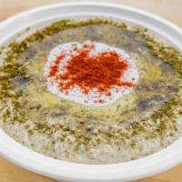 Classic Hummus / Tahini · Classic hummus tahini bowl sprinkled with paprika, zaatar and drizzled with olive oil.