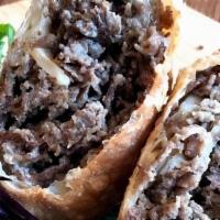 Cheesesteak Egg Rolls · Served with spicy ketchup