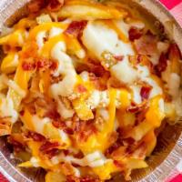South Jersey Cheese Fries · Three types of cheese sprinkled with  bacon.