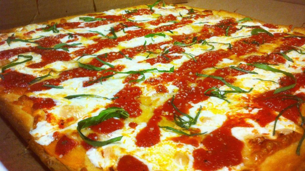 Brooklyn Style Pizza · A square thin crust pizza with olive oil, fresh mozzarella, grated parmesan, fresh basil, and fresh plum tomato sauce.