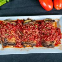 Eggplant Rollatini · Eggplant stuffed with ricotta & romano cheeses, baked and topped with marinara.