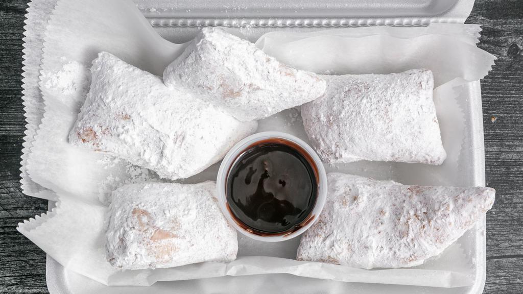 Fried Dough · Served with powdered sugar, chocolate or raspberry sauce.