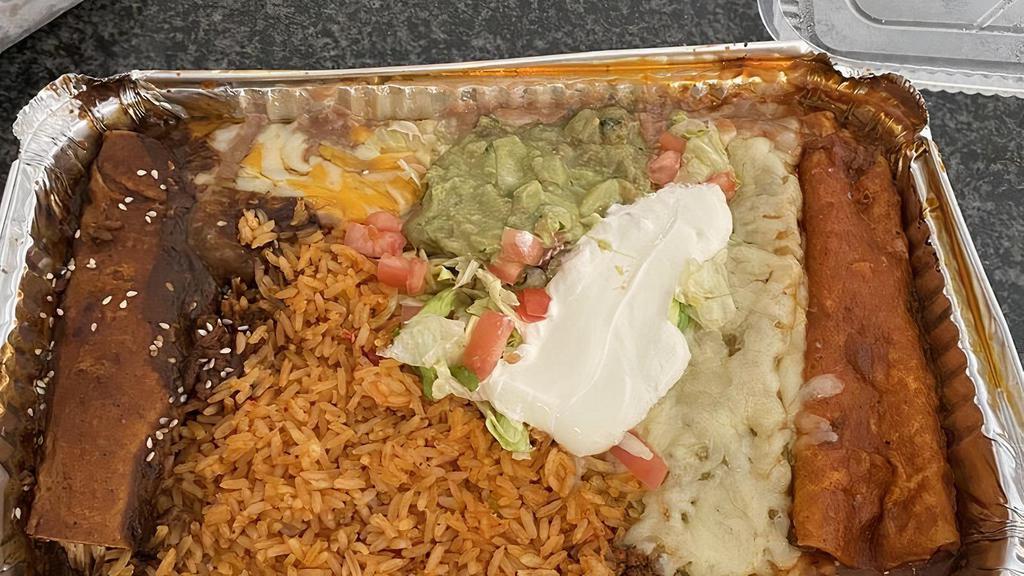 Seafood Enchiladas · Two enchiladas stuffed with blend of shrimp, crab, scallops, fish and fresh vegetables. Served with rice, refried beans, and garnished with sour cream, avocado, lettuce, and tomatoes.
