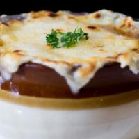 Zuppa Di Cipolle · Caramelized onion soup topped with provolone cheese.