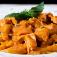 Penne Con Salmone · Diced salmon served in vodka sauce.