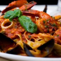 Fettuccine Con Frutti Di Mare · Tossed with shrimp, calamari, mussels, and clams in a light tomato sauce.