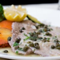 Vitello Piccata · Sautéed veal medallions with capers in a white wine lemon sauce.