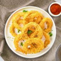 Onion Rings  · (Vegetarian) Sliced onions dipped in a light batter and fried until crispy and golden brown.